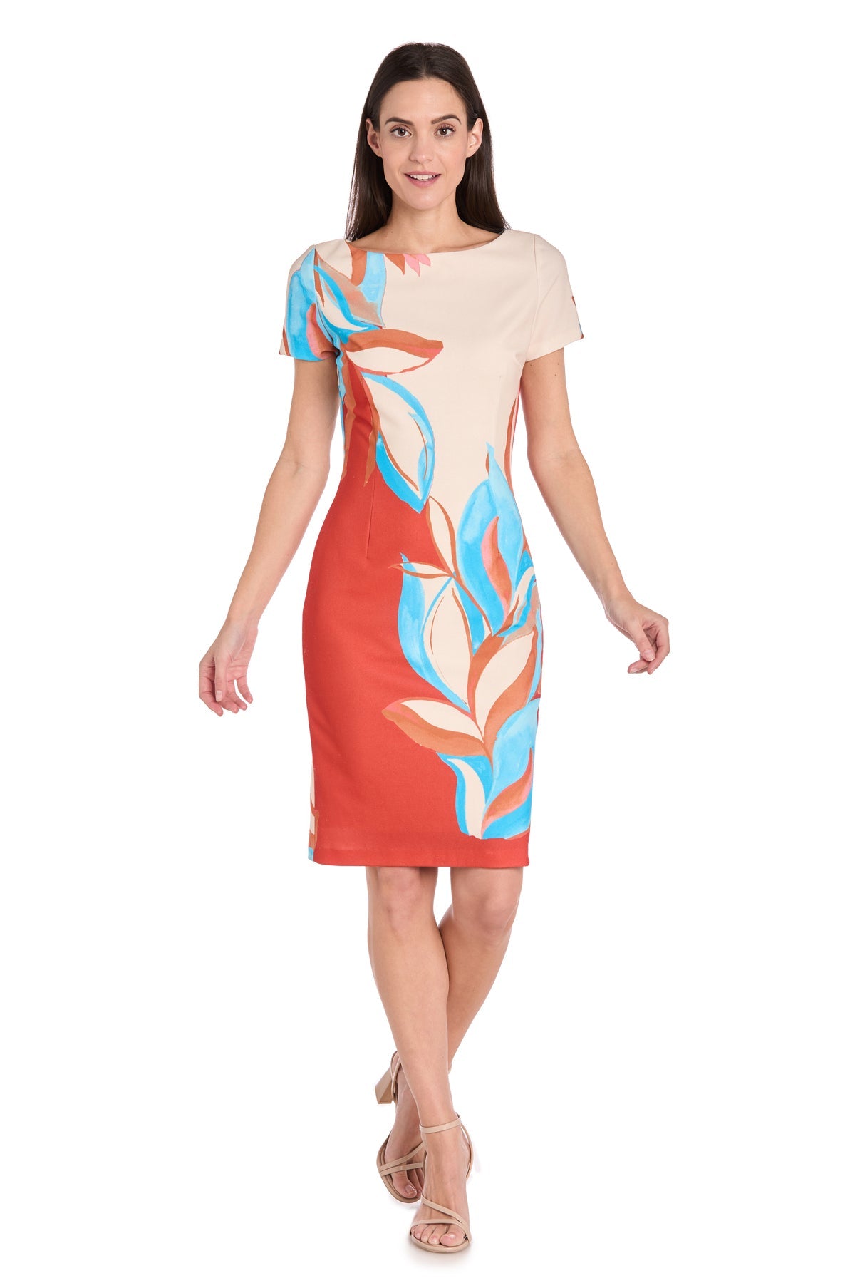 A woman stands against a white background, wearing the R&M Richards 4200 Bright Knee-Length Party Dress featuring a beige top, red skirt, and bold blue and orange leaf patterns.